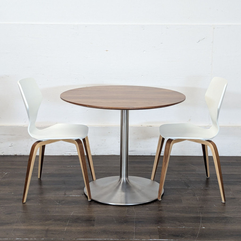 Modern walnut-topped dining table and two matching wooden dining chairs in excellent condition.