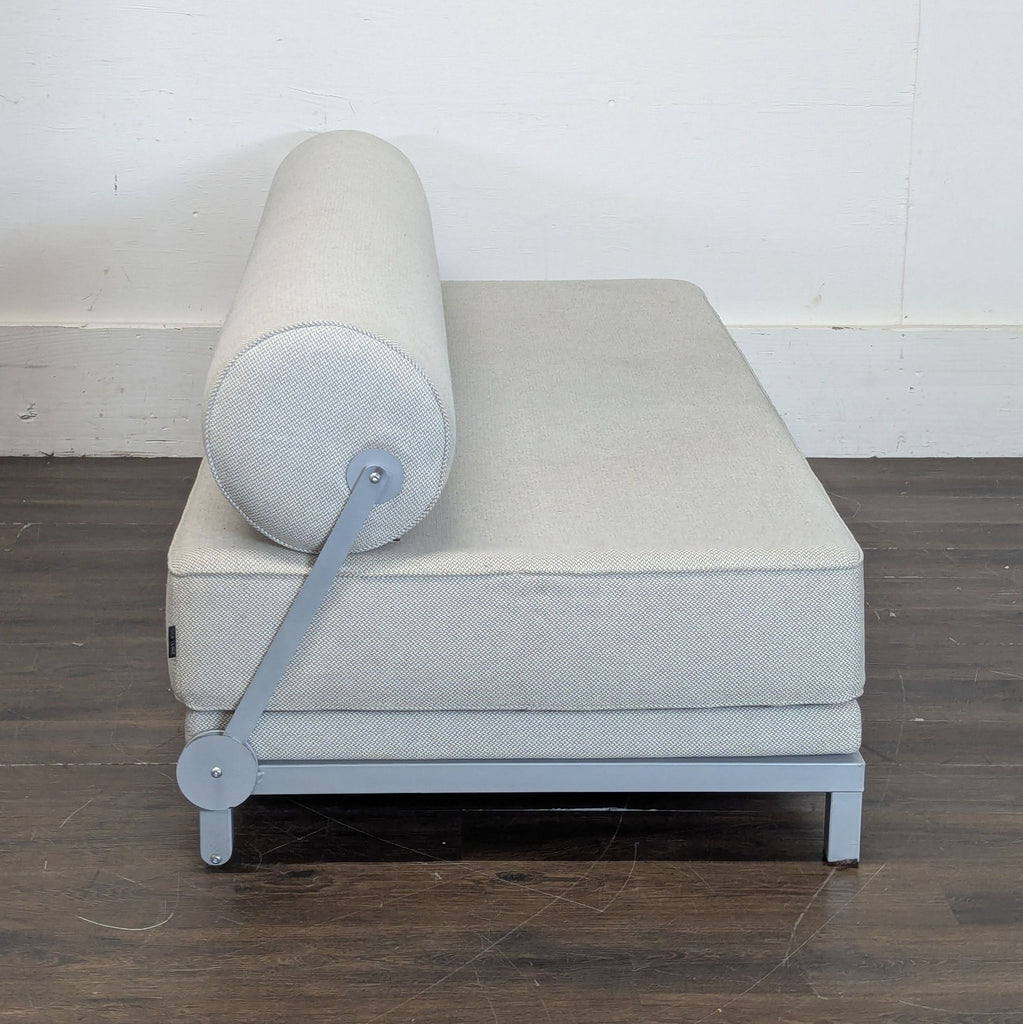2. Stylish three-seater couch with wooden legs, designed for both comfort and elegance.