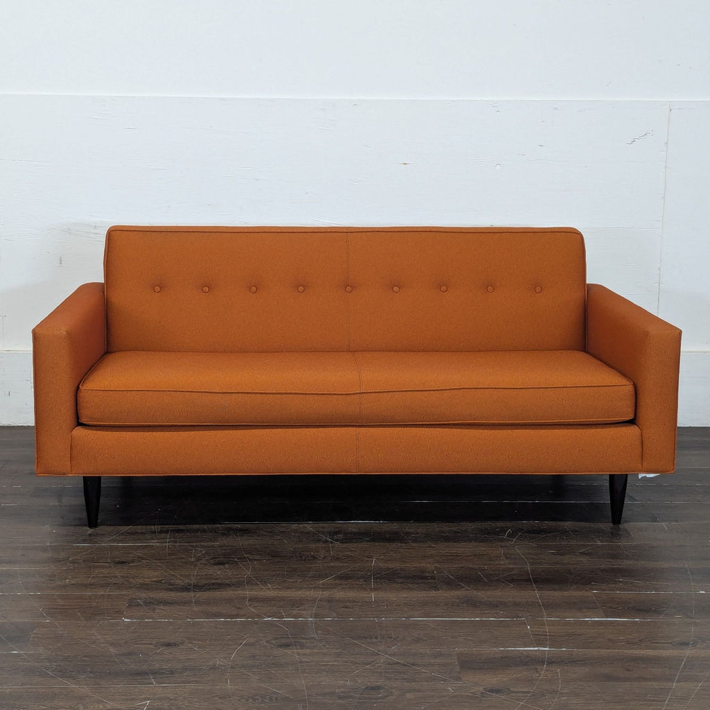 1. Modern 3-seat sofa with plush cushions, ideal for a contemporary living room setting.