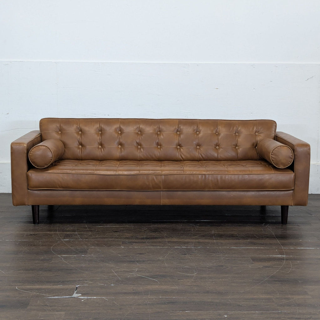 1. Modern 3-seat sofa with plush cushions, ideal for a contemporary living room setting.