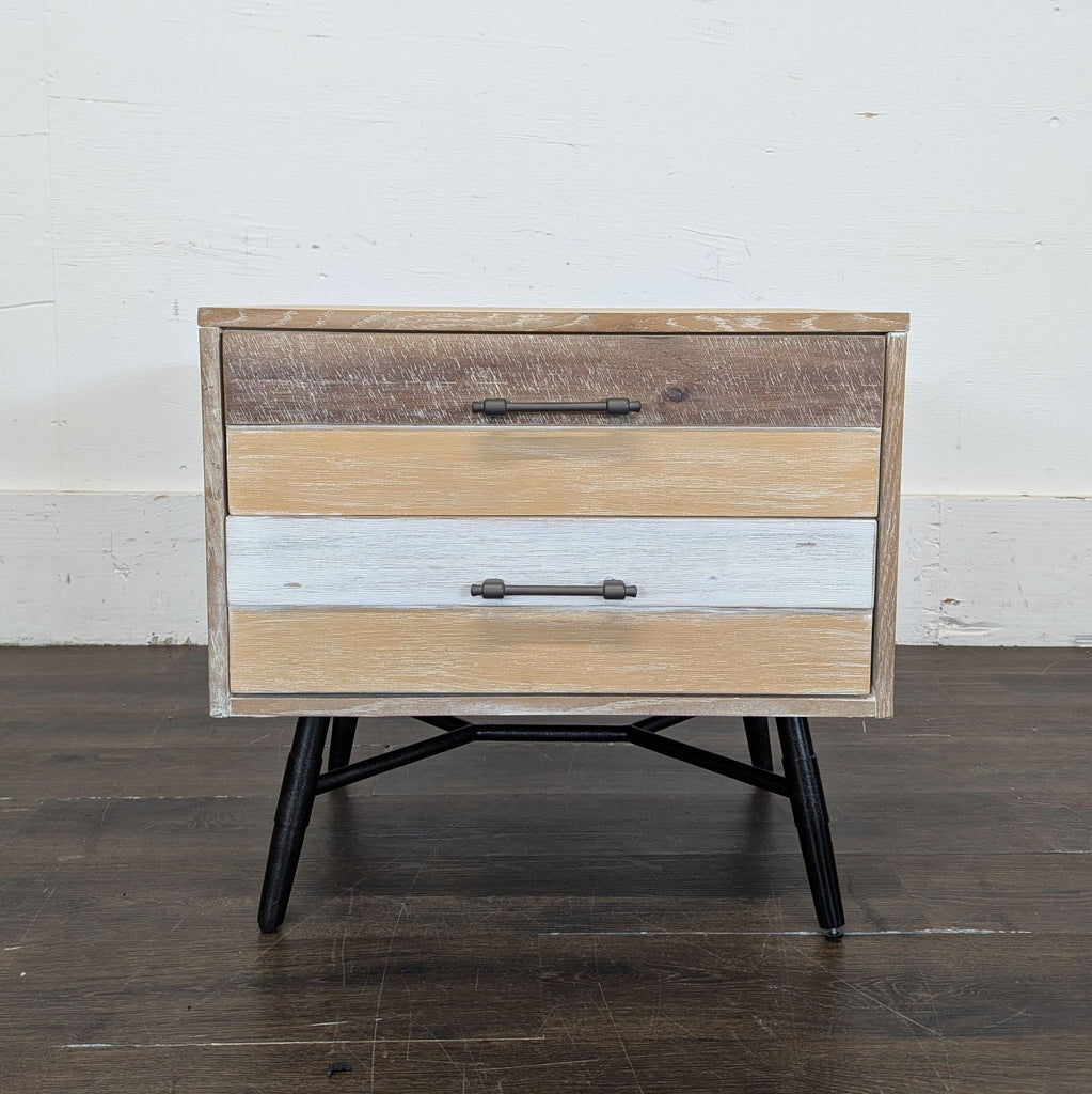 3. Modern Coaster end table with two drawers, mixed wood tones, black handles, and angled black legs.