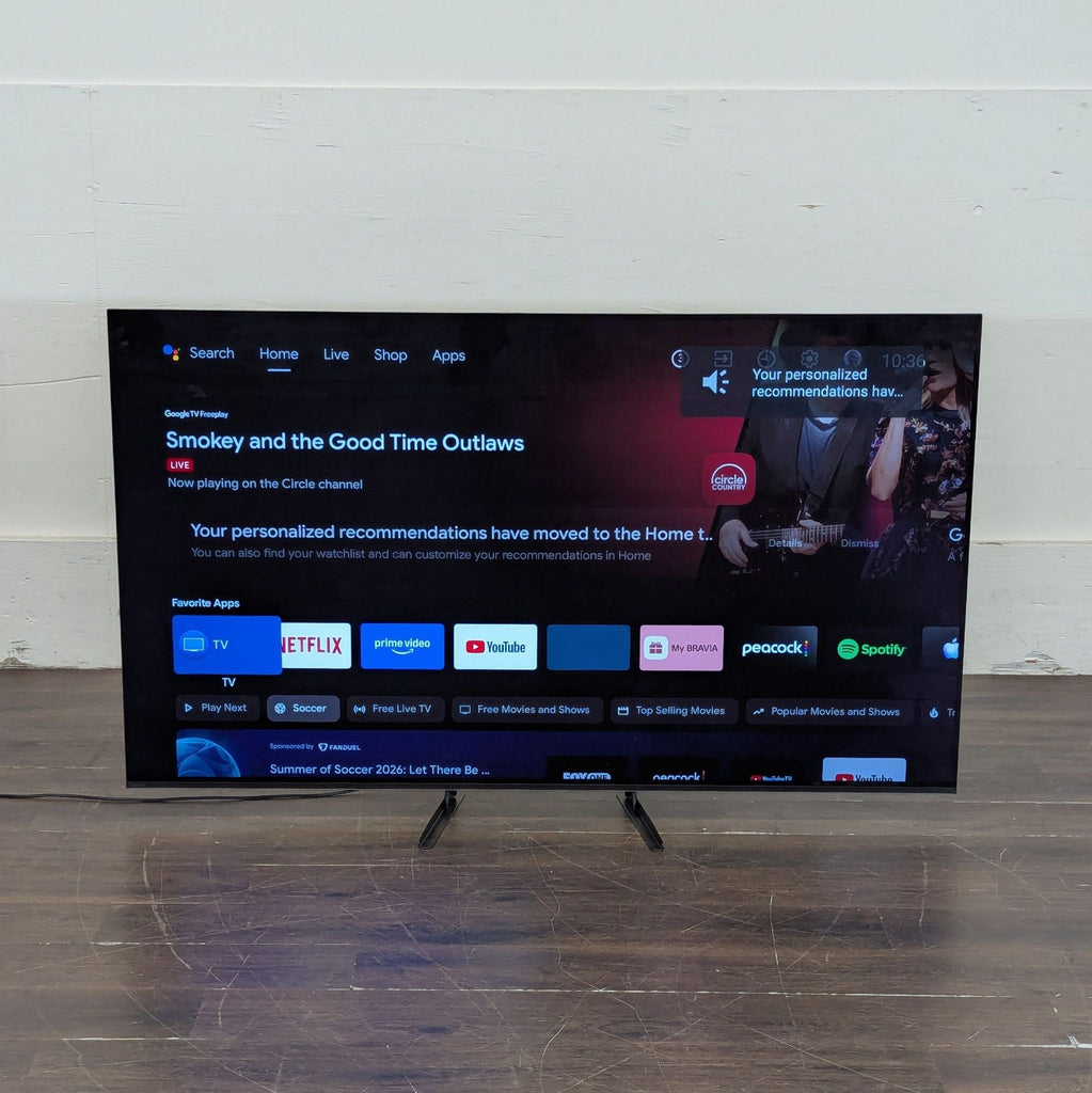 2. Sony smart TV on a stand, showing streaming apps and recommendations on the home screen.