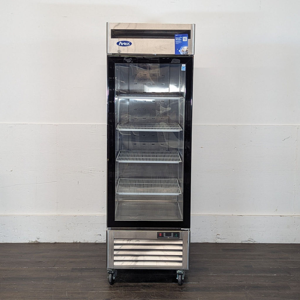 1. Atosa commercial refrigerator with glass door and four shelves, wheels at base, door closed.