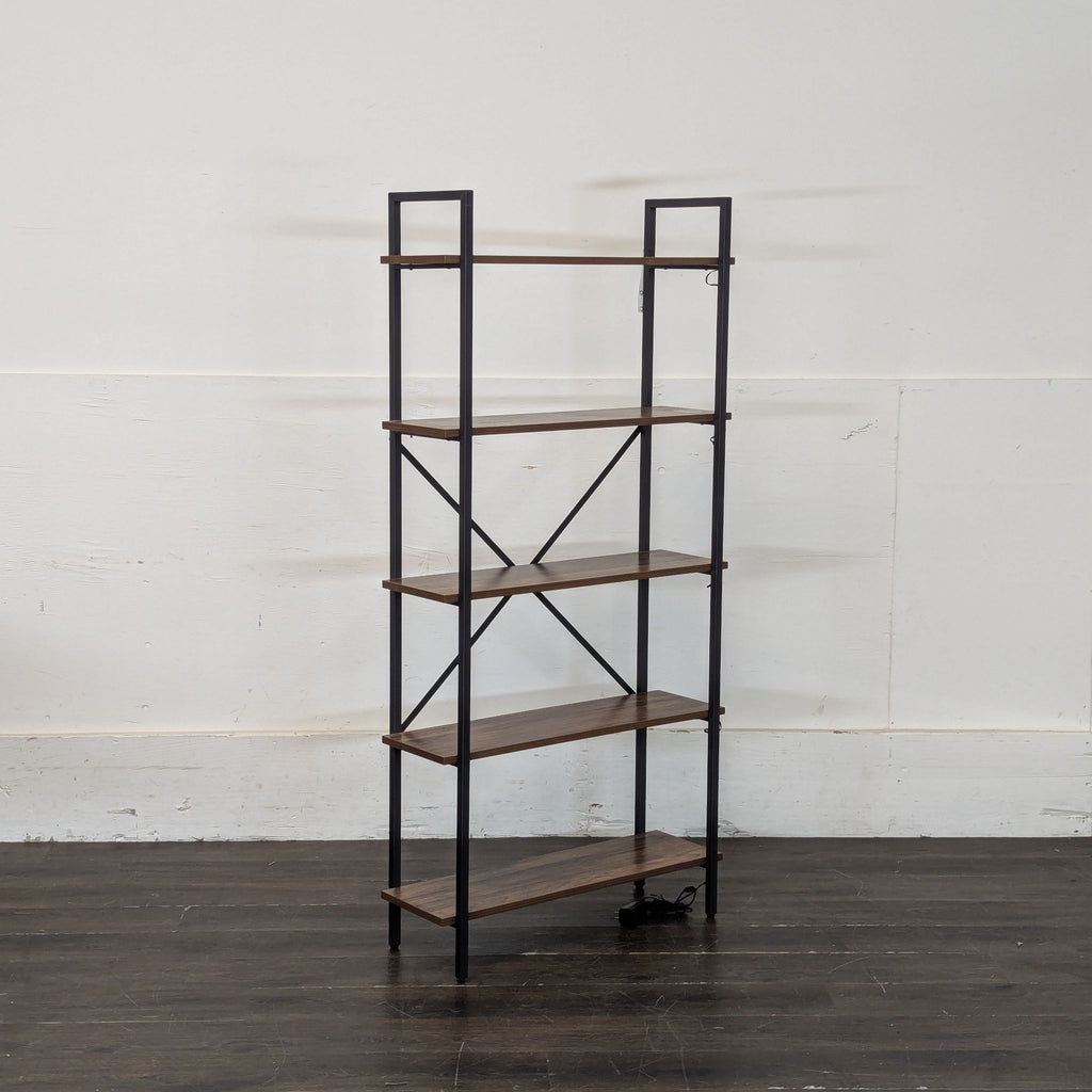 3. Angled view of an empty, modern bookshelf featuring five wooden shelves and a black metal frame on a wooden floor.