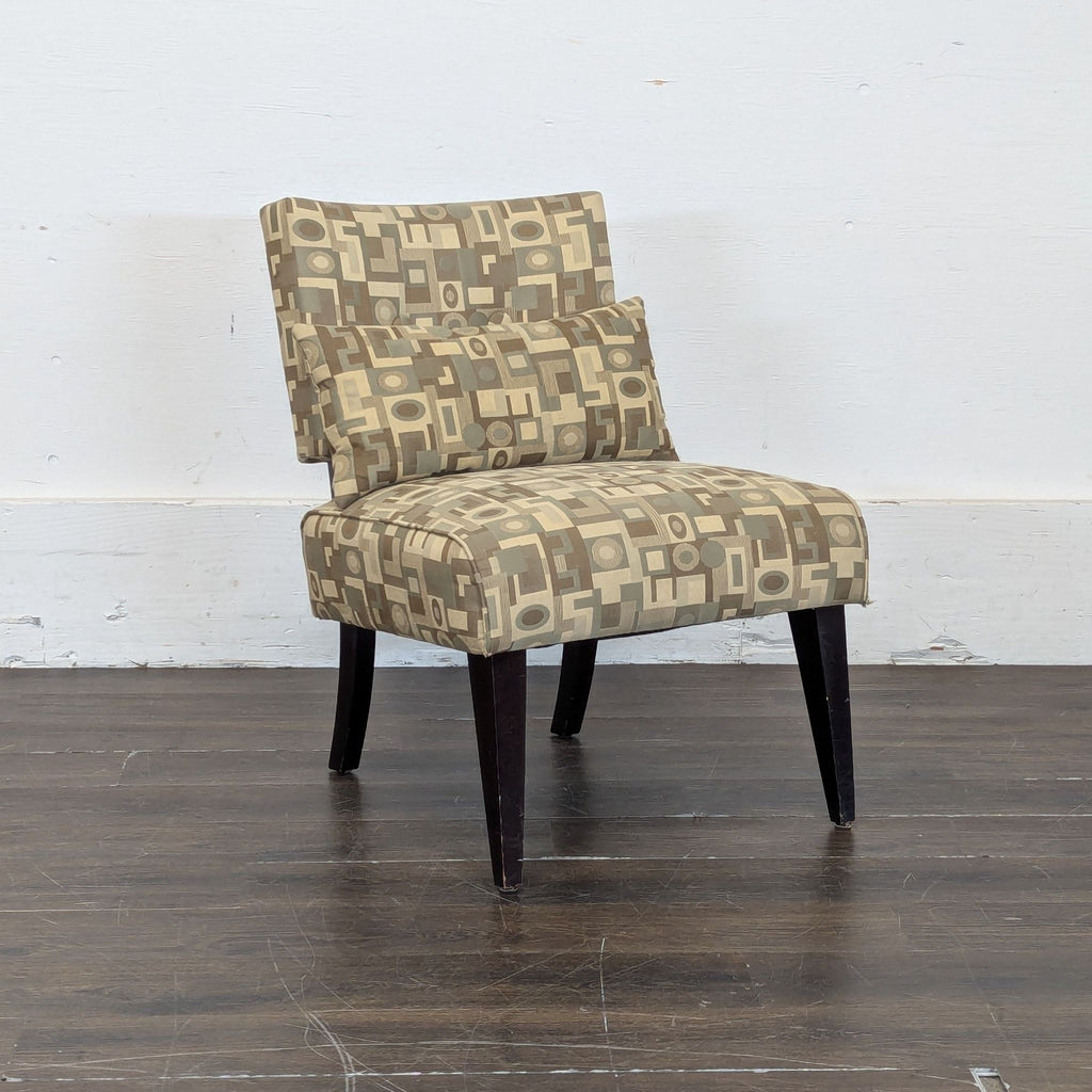 3. Accent chair by Crate & Barrel in the Lounge category, displaying retro-style fabric with a geometric motif and sleek wooden legs.