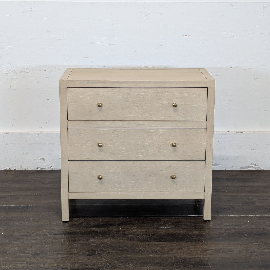 2. Simple modern dresser by Butler Specialty Company with three drawers and brass knobs, shown against a plain wall.