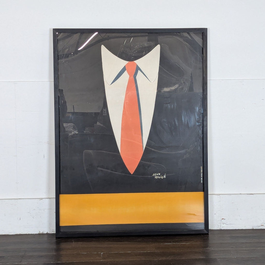 2. Print features minimalist artwork of a suit collar and bright orange tie on a black background.