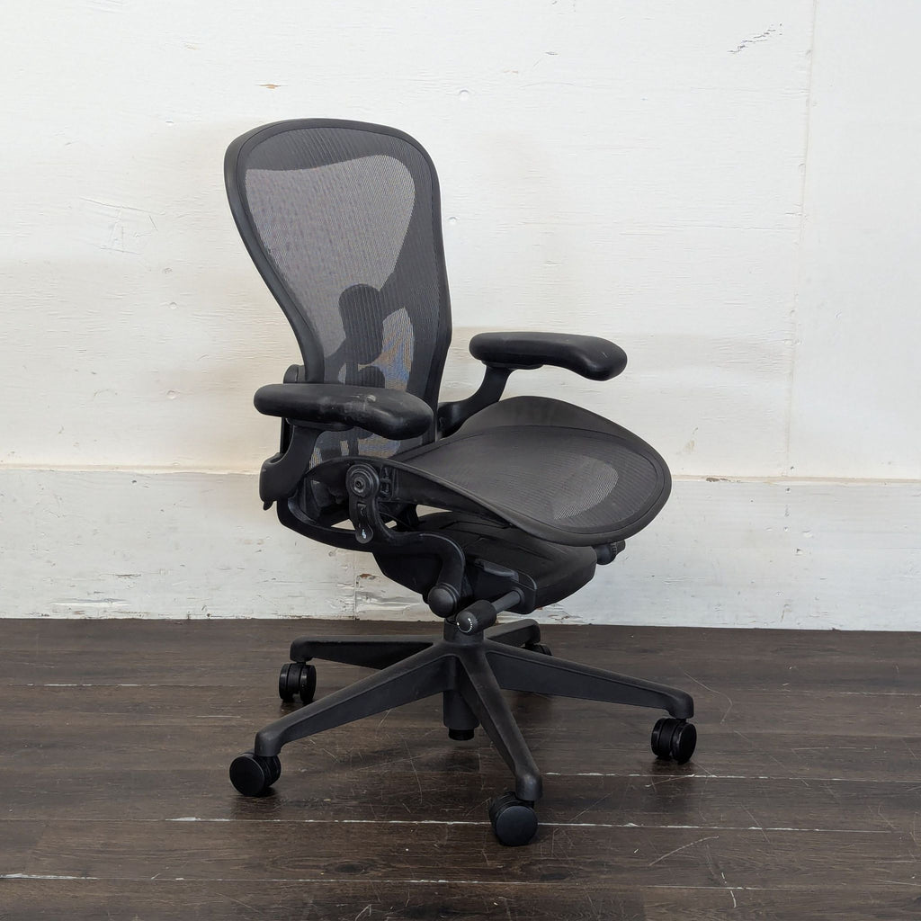 Pair of high-end Herman Miller Aeron chairs, mesh seat and back, listed for $2,000 each, used.