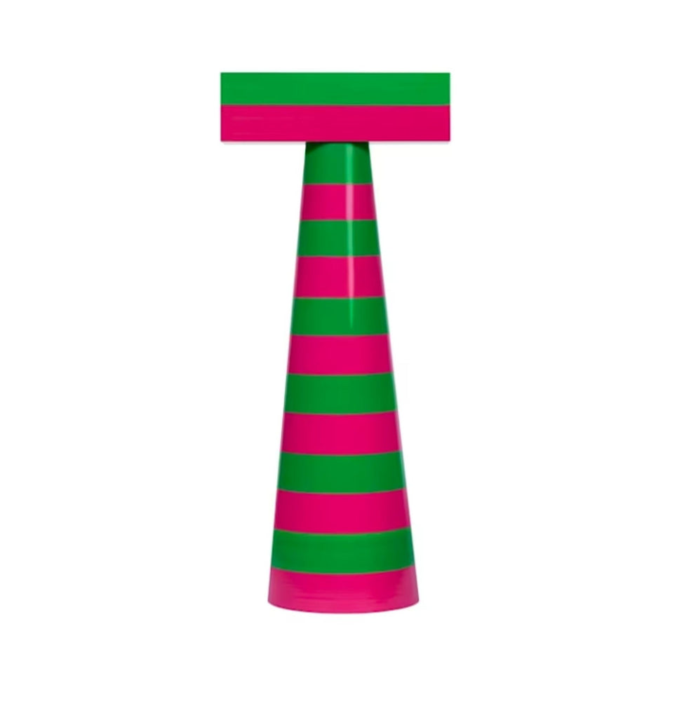 a green and white vase with a flower on it 