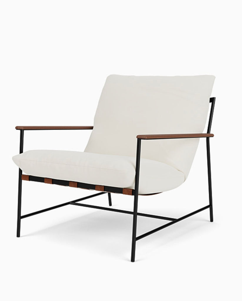 1. Lounge chair by Reperch with white cushions, slim black metal frame, and wooden armrests, front view.  