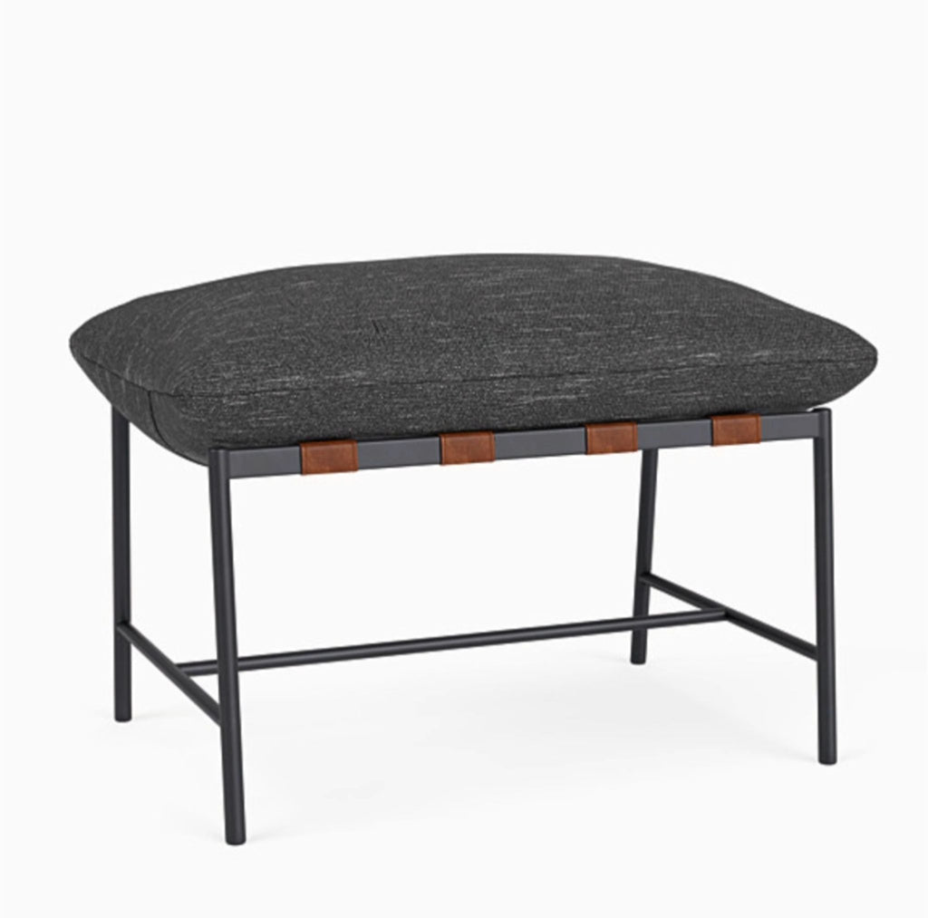 2. Denver Modern ottoman featuring onyx linen fabric, accented with leather straps and a sleek steel base.