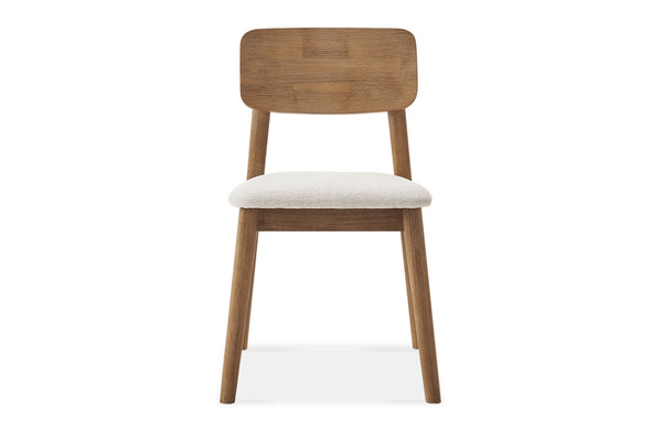 Front view of Reperch dining chair with wooden frame and cushioned cream seat in minimalist style.  