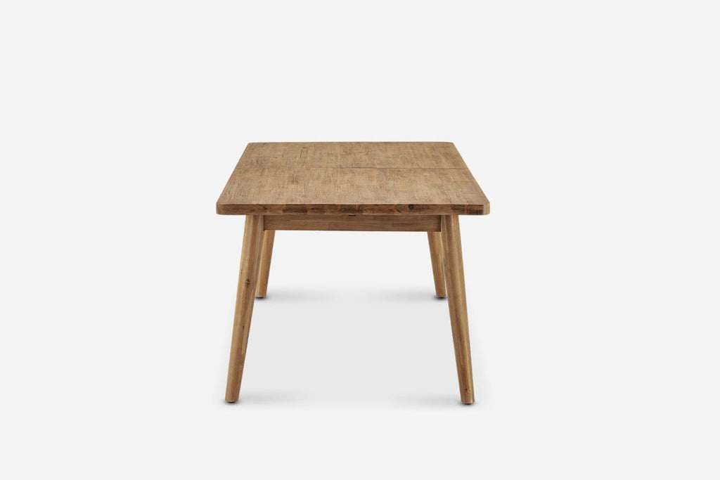 2. Side view of the Reperch dining table showcasing its thick wooden top and sturdy legs.