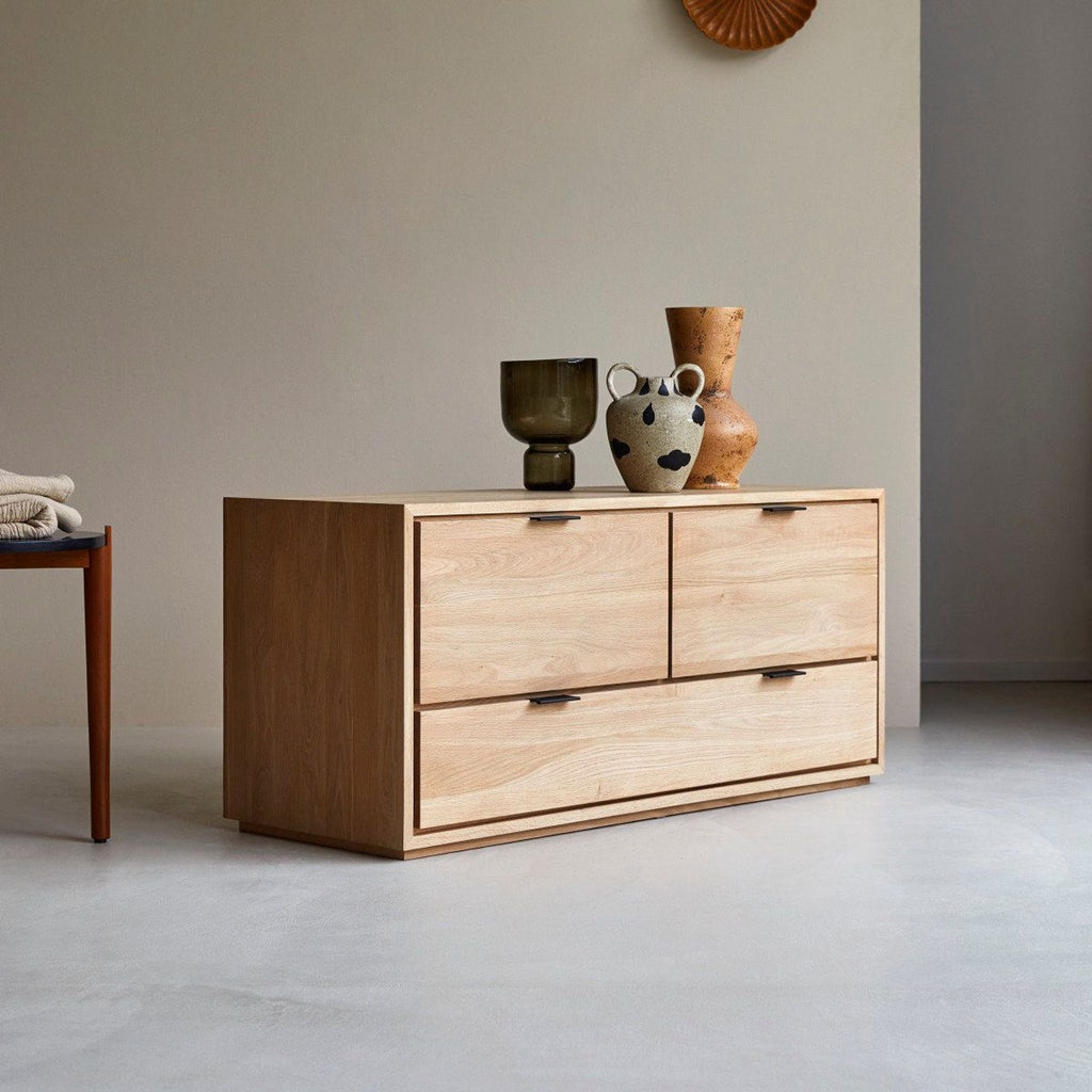 1. Contemporary solid oak Tikamoon entertainment center with a minimalist design, styled with decorative vases.