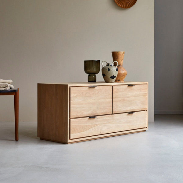 1. Contemporary solid oak Tikamoon entertainment center with a minimalist design, styled with decorative vases.