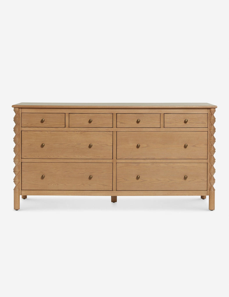 a large chest of drawers with a light wood finish.