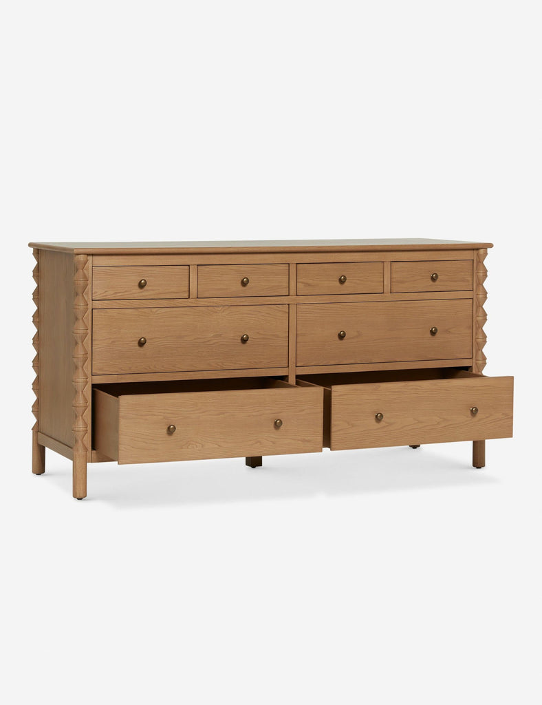 a dresser with drawers in a light wood finish.