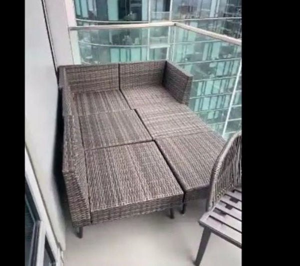 1. Outdoor wicker chair set arranged on a balcony, shown in good condition, ideal for compact spaces.