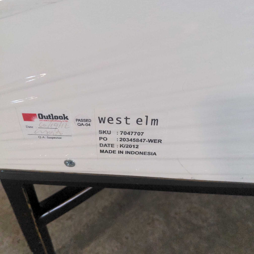 1. Label on a West Elm end table showing SKU, PO, origin, and inspection details, made in Indonesia.