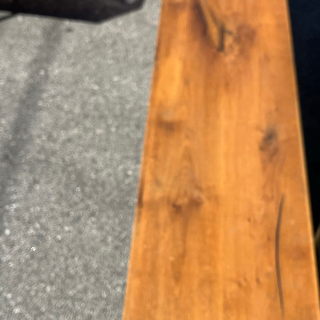1. Close-up view of a wooden bench seat with visible wood grain, part of Stools, Ottomans & Benches category.