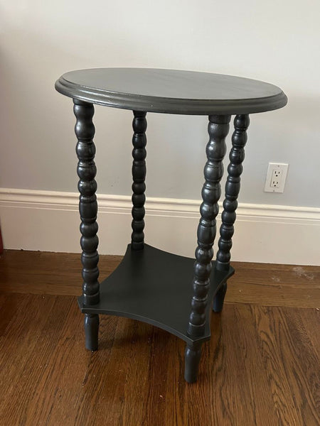 Of course! However, I don't see any images or specific descriptions attached to your message. If you could please upload the images or share relevant details about the end table, I can write three distinct alt text descriptions as requested.