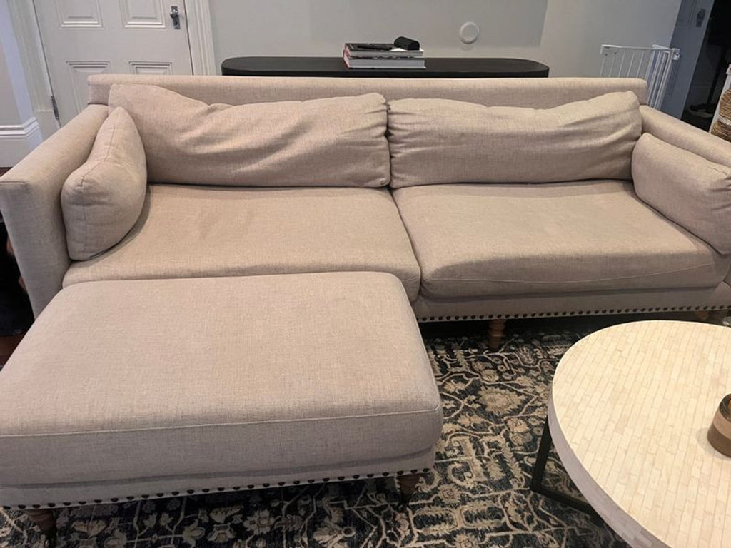 1. Modern 3-seat Pottery Barn couch with plush cushions and neutral upholstery, perfect for living rooms.