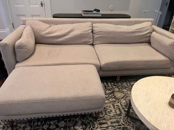 1. Modern 3-seat Pottery Barn couch with plush cushions and neutral upholstery, perfect for living rooms.