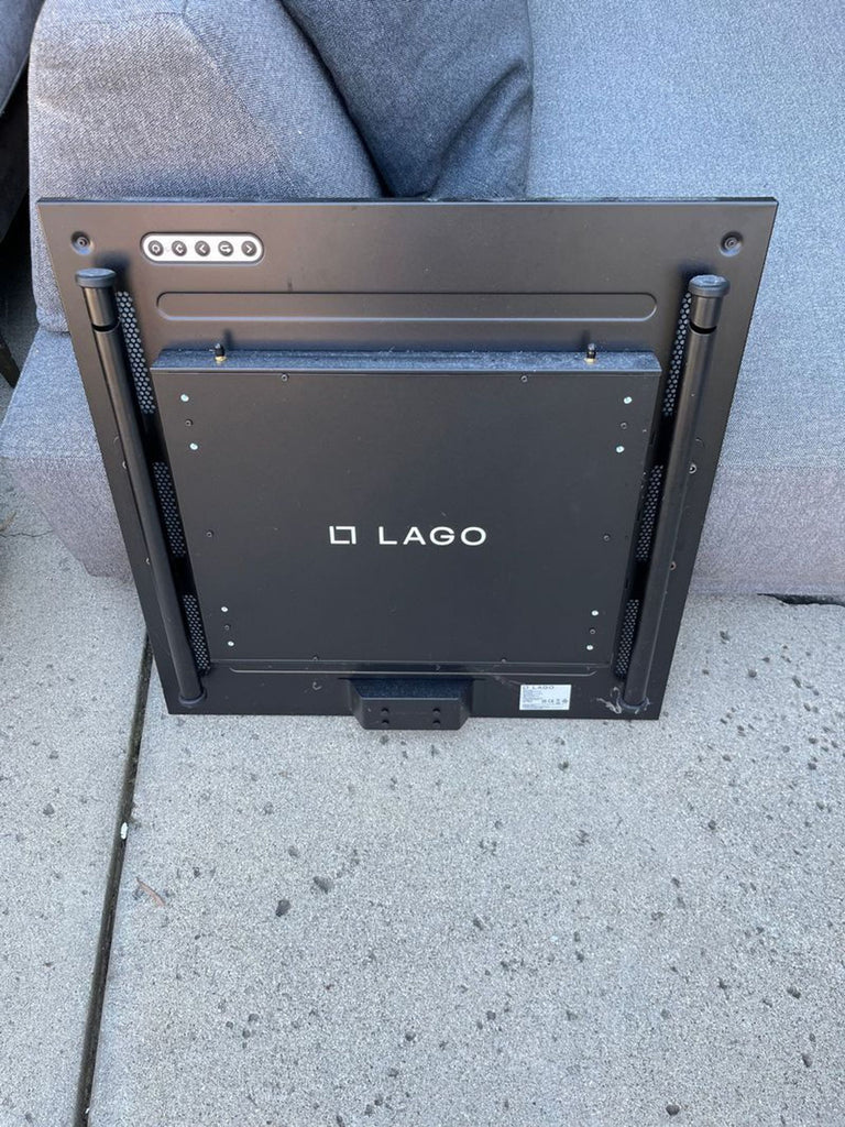 3. Back of the LAGO Frame Genesis, revealing the brand name and mounting features on a black panel.