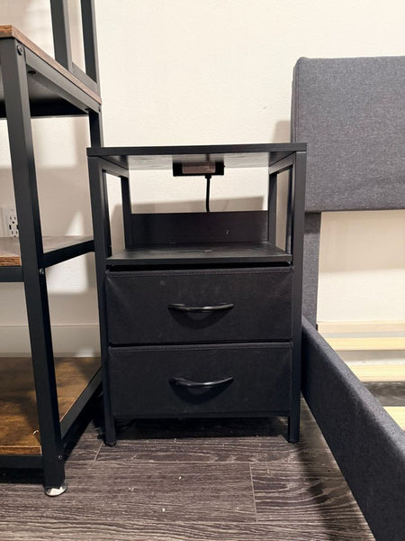 1. Black Yoobure Home end table with two fabric drawers and an open shelf, positioned between other furniture.