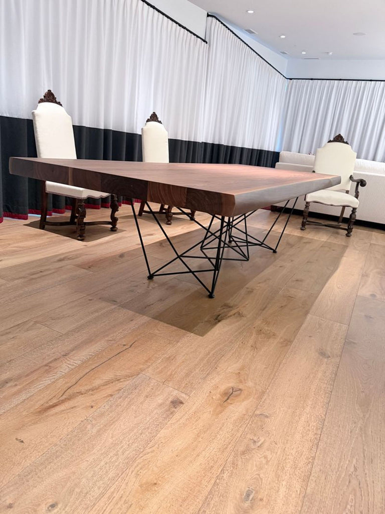 3. Elegant Cattelan Italia table with warm wooden surface and contemporary angular metal support.