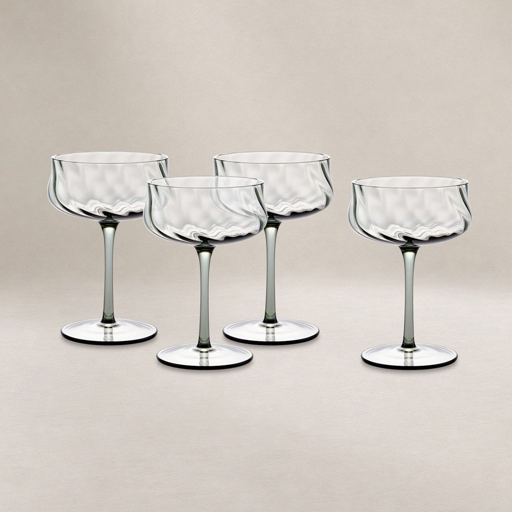 Set of four Castlery coupe glasses with ripple texture, ideal for cocktails or desserts, dishwasher safe.