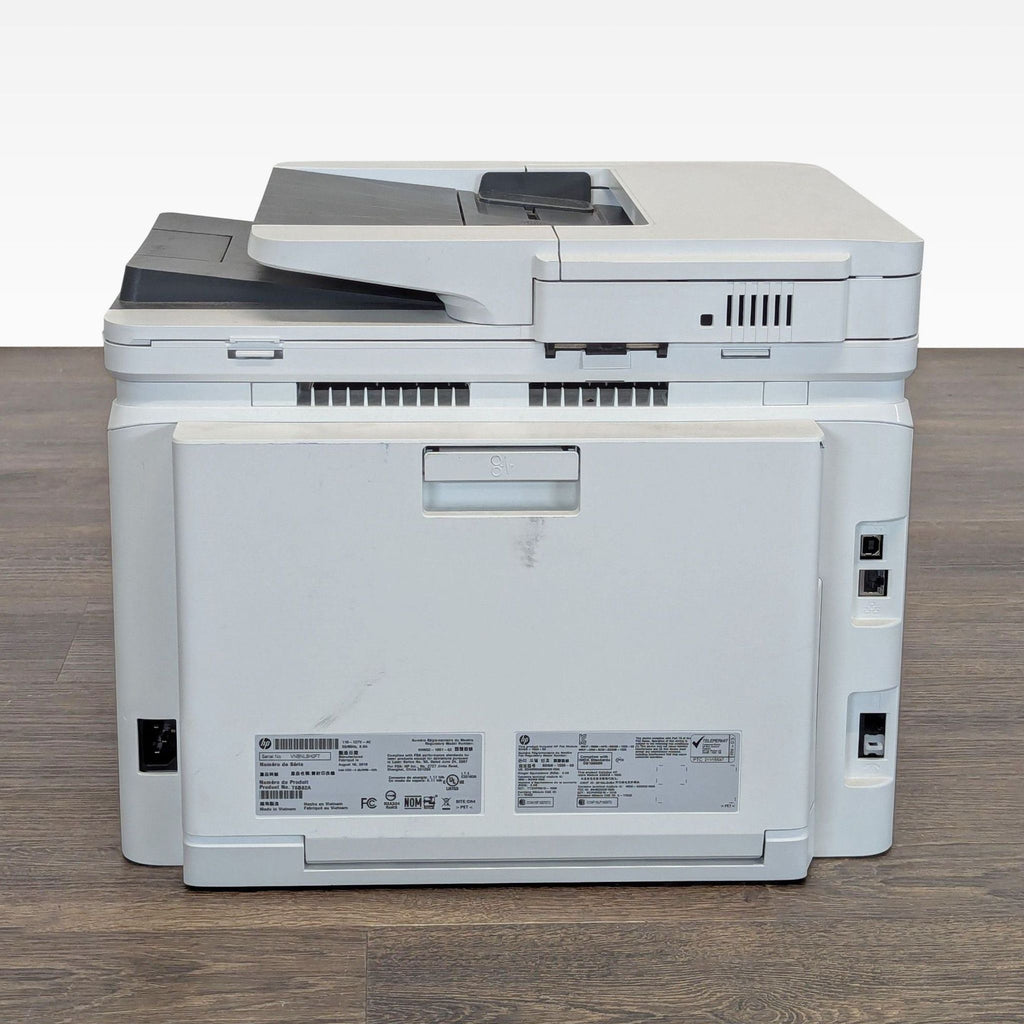 Compact HP color laser printer offering print, scan, copy, fax functions; features touchscreen and wireless support.