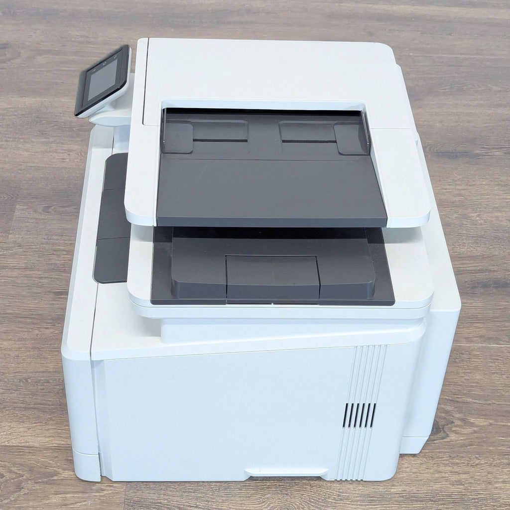HP all-in-one color laser printer for home or office use, featuring ADF, touchscreen, and wireless connectivity.