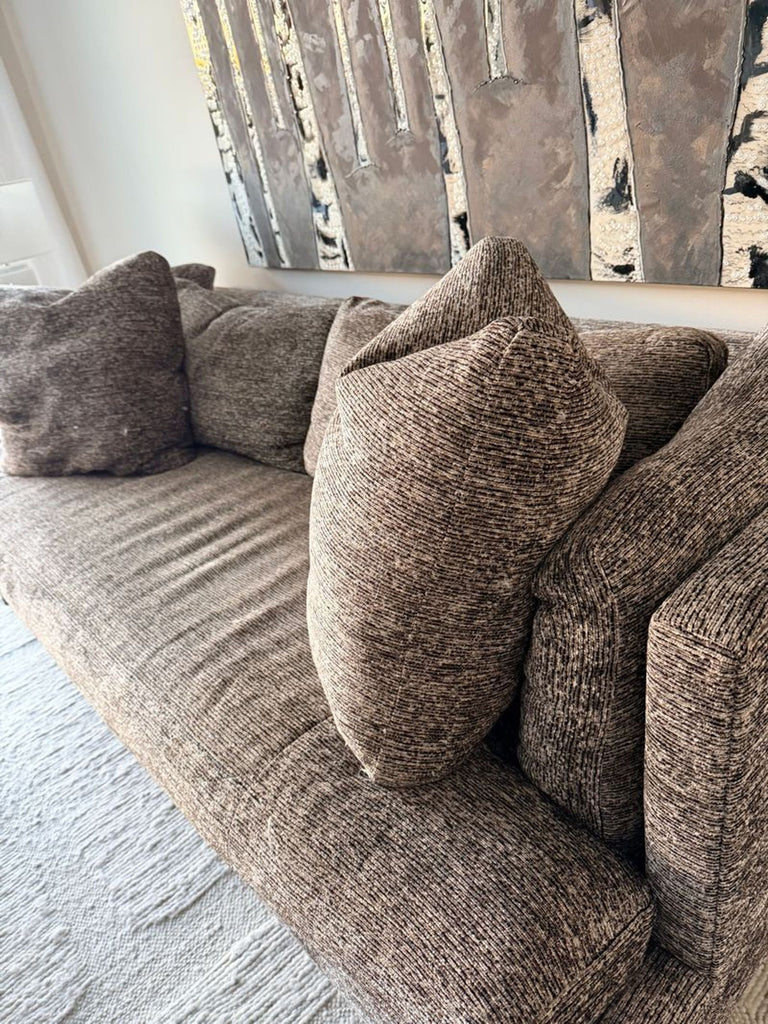 Plush, neutral-toned Theodore Alexander sofa for three; features sturdy metal legs and a stylish, modern look.