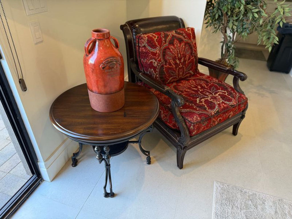 Comfortable Paul Schatz lounge chair with rich red floral upholstery and sturdy wood frame, perfect for any living area.