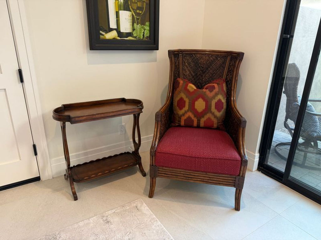 Sturdy Lexington lounge chair with red cushion and decorative pillow, suitable for indoor or outdoor lounging.