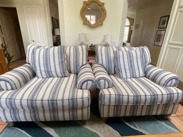 Pair of Craftmaster lounge chairs with blue and white stripes, rolled arms, and wooden legs, perfect for relaxing.