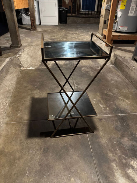 1. Reperch side and console table with glass shelves and metal frame, shown in an industrial-style room.