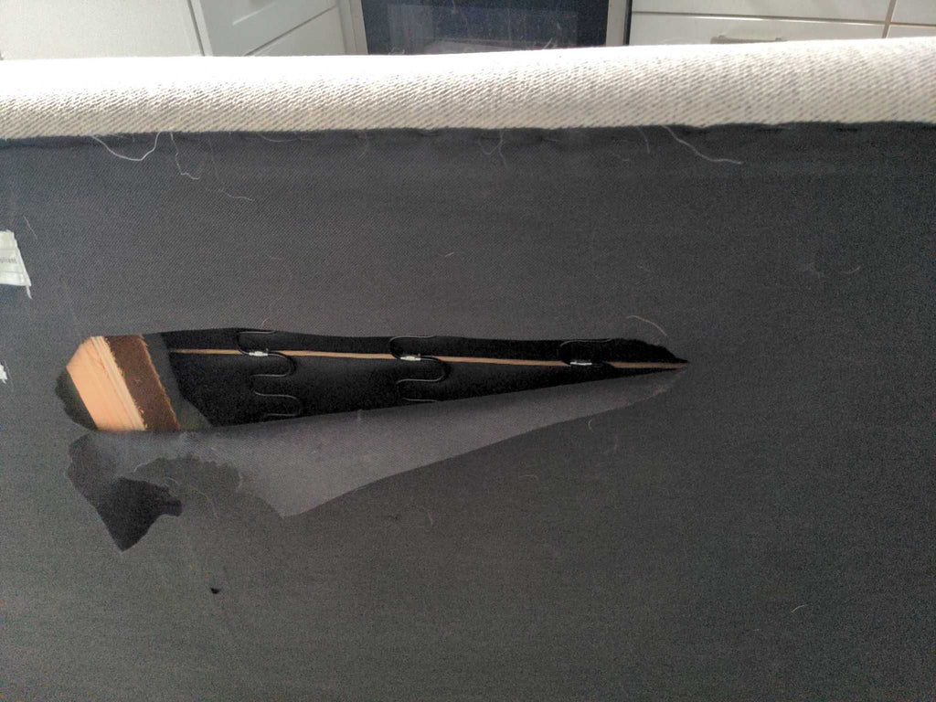 a piece of black fabric that is cut into a piece of furniture.