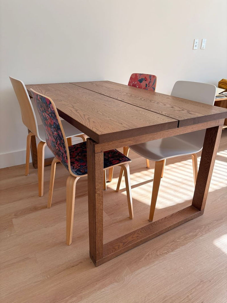 1. IKEA MÖRBYLÅNGA / GRÖNSTA dining table with wood top and four mixed patterned chairs in a bright room.  