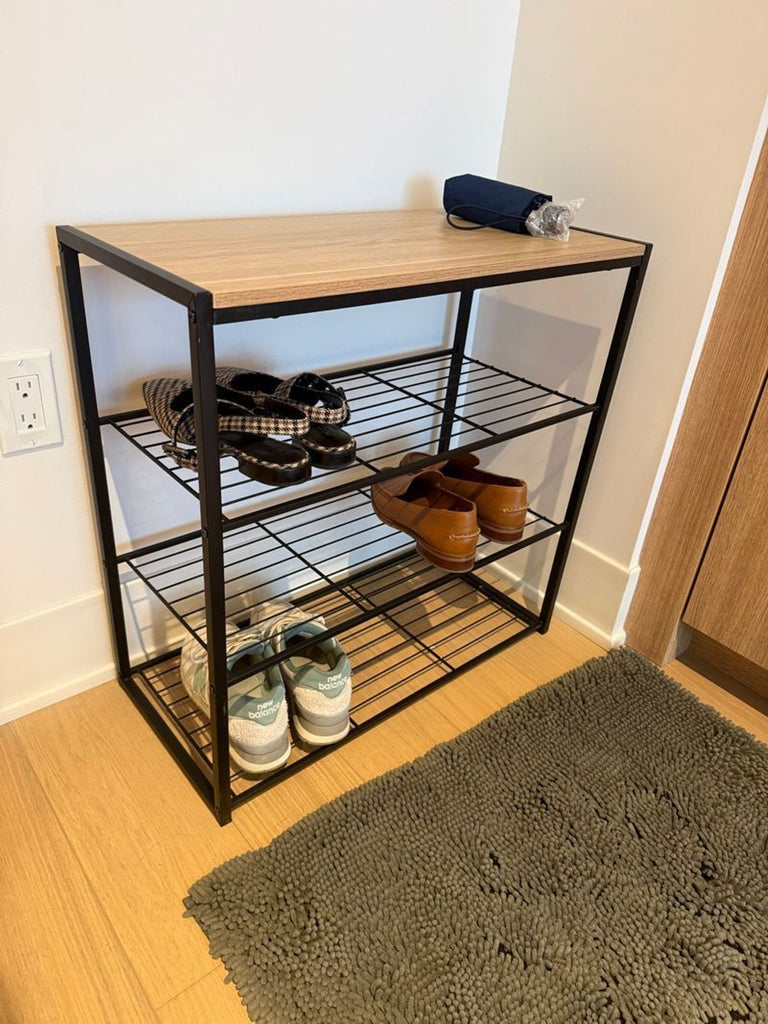 Sleek shoe rack with multiple shelves, designed as a side and console table for organized footwear storage.