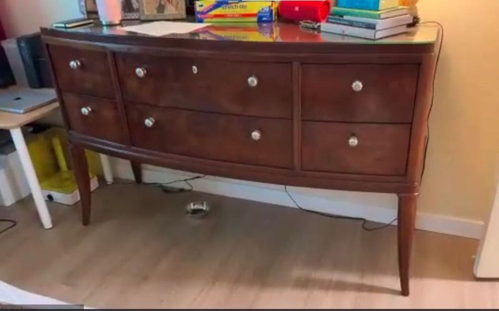 Large solid wood dresser with spacious drawers and minimalist design, ideal for bedroom storage.