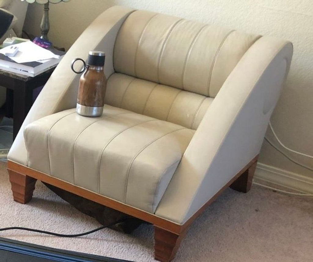 Set of Giorgetti lounge chairs in cream leather, showcasing modern style with comfortable, deep seats and wood legs.