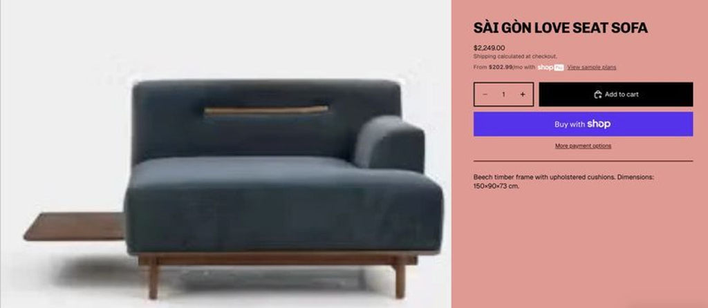 Modern sectional in blue fabric, sturdy wooden legs, and an integrated side table for added convenience.