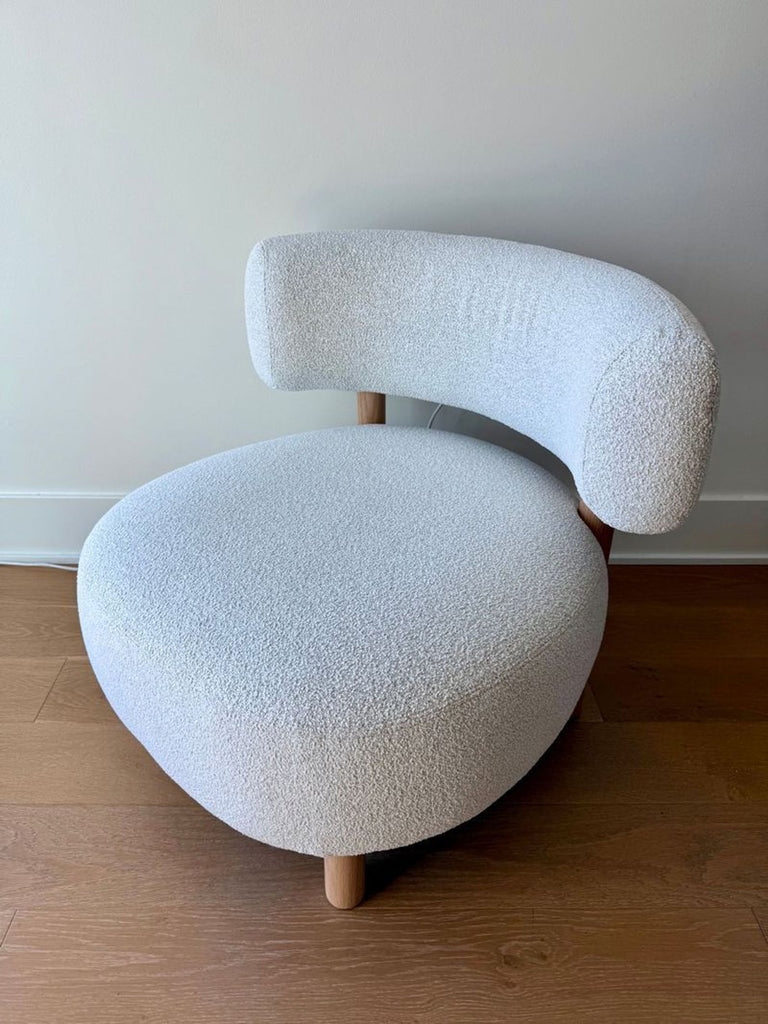 Gray and white IKEA Stockholm 2025 lounge armchair in perfect condition, displayed against a plain background.