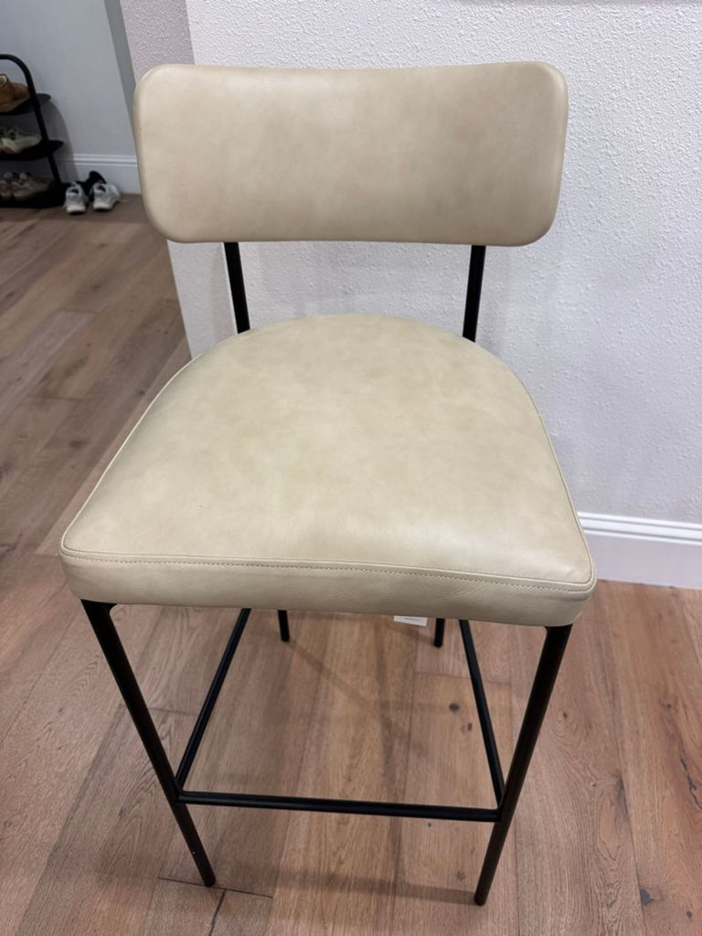 3. Contemporary Pottery Barn Maison barstool with smooth leather upholstery and footrest, perfect for modern bars.