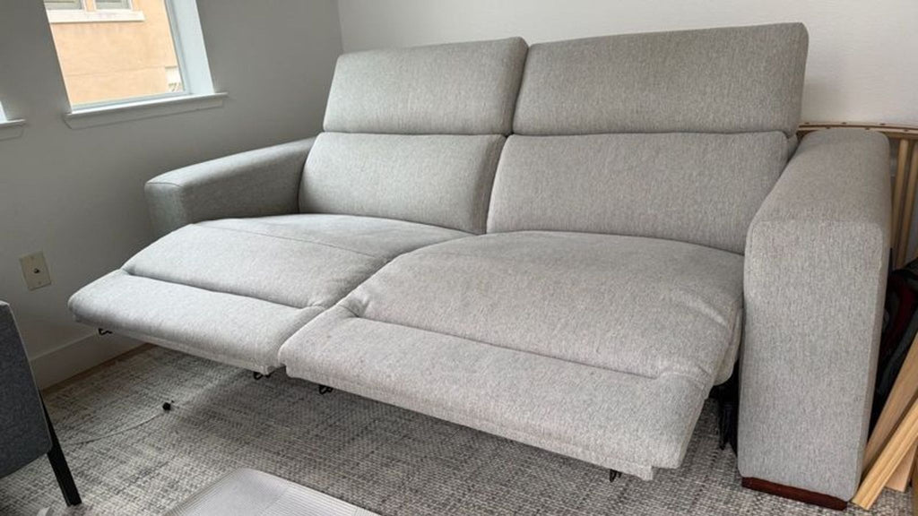 1. Light gray Reperch sectional with extended footrests shown in a modern living room setting.