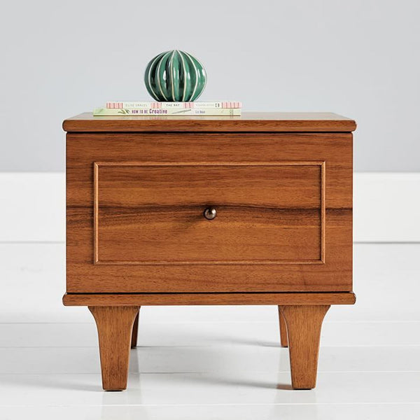 a wooden table with a wooden head board 