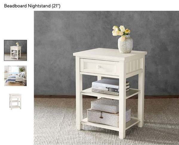 1. Pottery Barn round wooden end table with lower shelf, displayed against a plain background.  