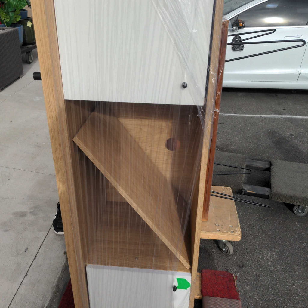 1. Modern wooden entertainment center with shelves and space for a large TV, books, and decor.  
